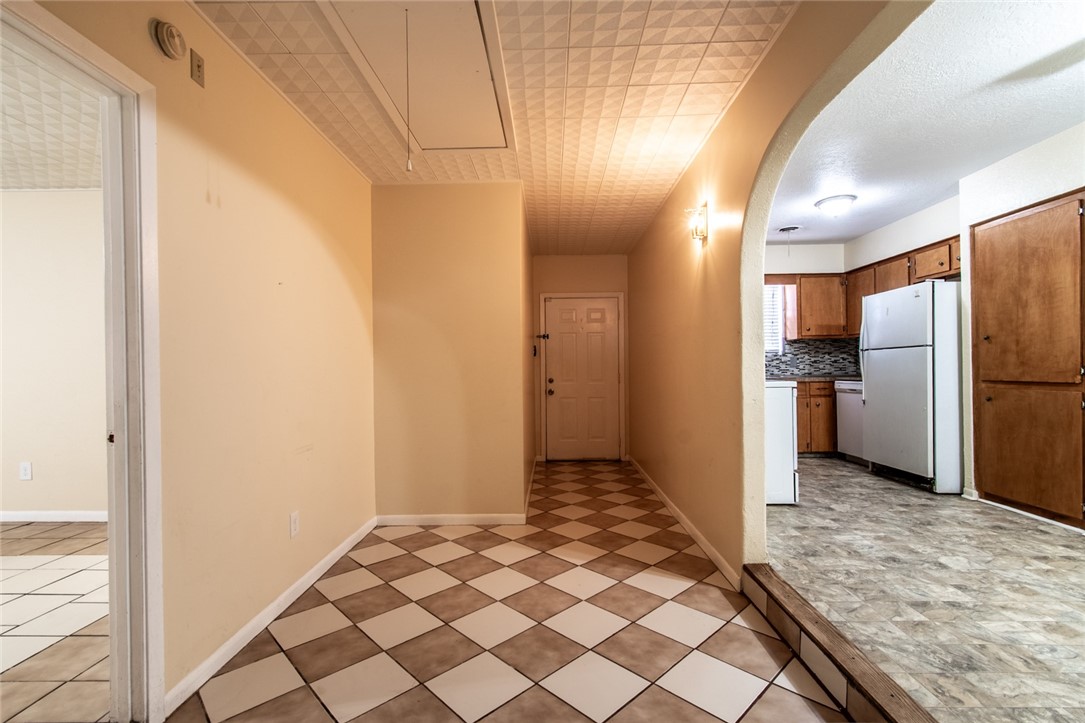 5802 Limerick Drive Corpus Christi, TX 78413 - Photo 14 of 34 a view of a refrigerator in kitchen and wooden floor