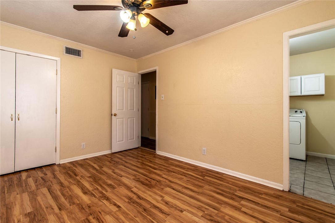 5802 Limerick Drive Corpus Christi, TX 78413 - Photo 24 of 34 a view of an empty room with wooden floor