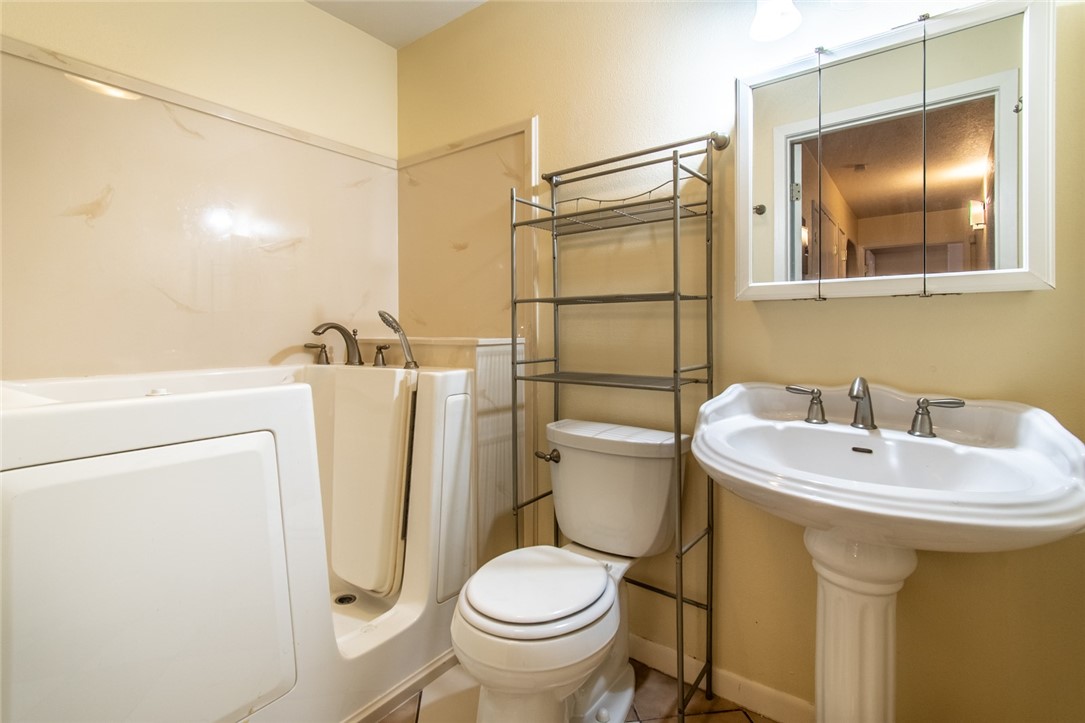 5802 Limerick Drive Corpus Christi, TX 78413 - Photo 27 of 34 a bathroom with a sink toilet and shower