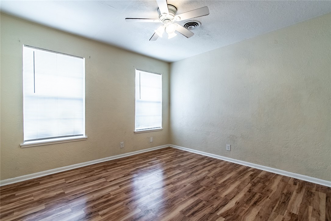 5802 Limerick Drive Corpus Christi, TX 78413 - Photo 28 of 34 wooden floor in an empty room with a window