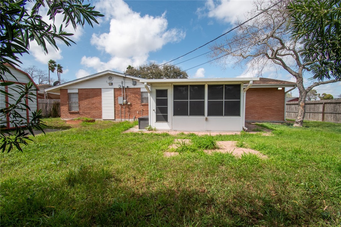 5802 Limerick Drive Corpus Christi, TX 78413 - Photo 33 of 34 a front view of a house with a garden and trees