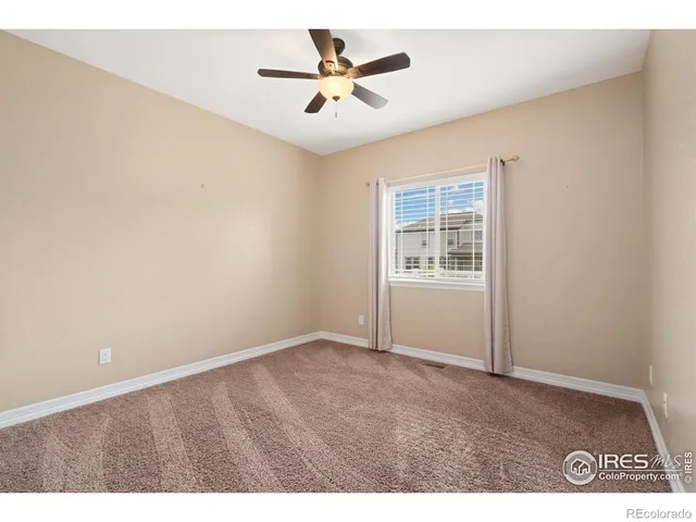 a bathroom with a sink mirror and toilet