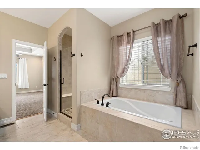 a view of livingroom with furniture wooden floor and fan