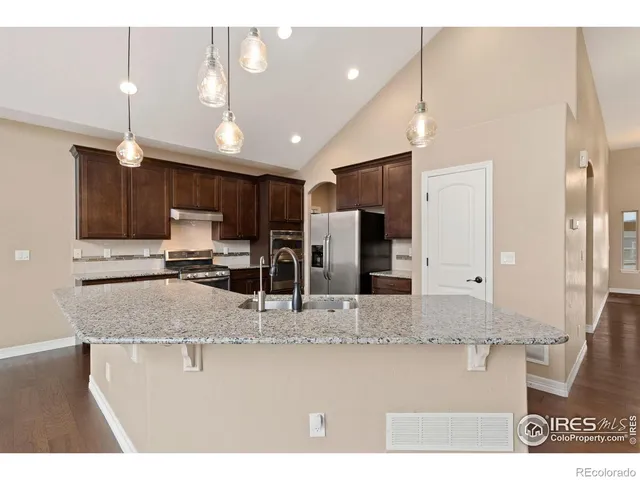 a view of kitchen and living room with a fireplace