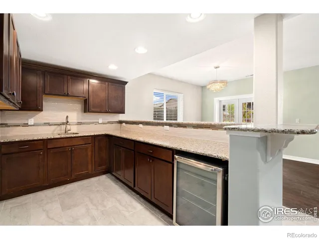 an empty room with a window and a ceiling fan