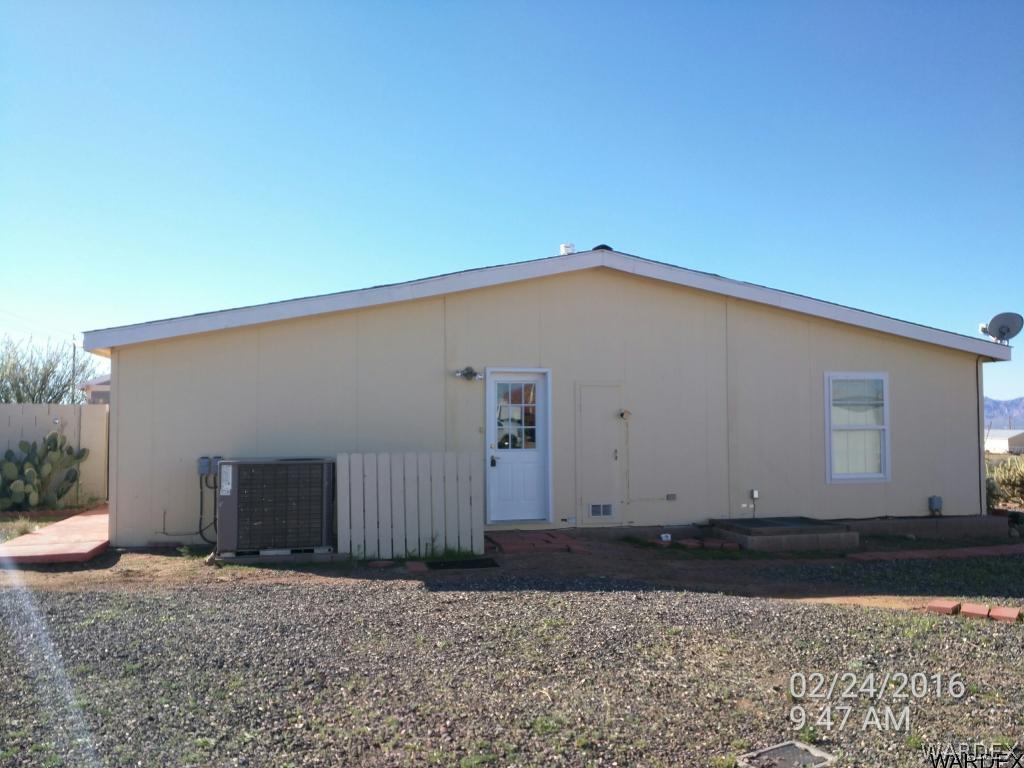 3425 Bacobi Road Golden Valley, AZ 86413 - Photo 3 of 24 Right side of property