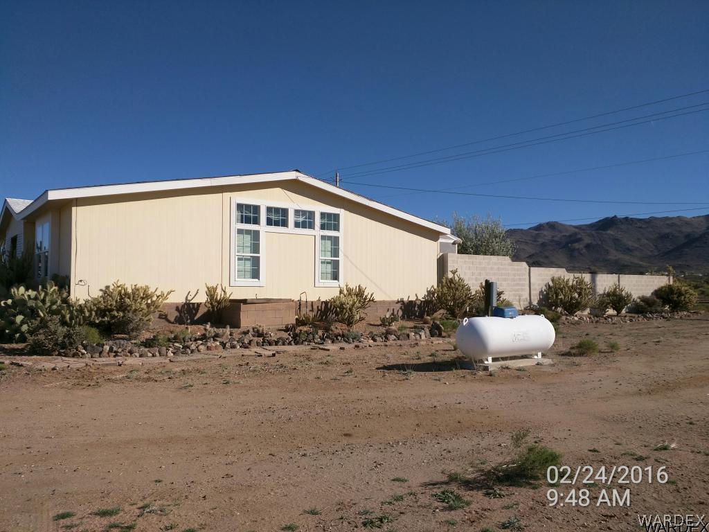 3425 Bacobi Road Golden Valley, AZ 86413 - Photo 4 of 24 Left side of property