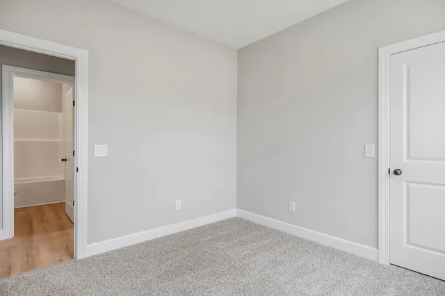 a bathroom with a granite countertop sink a toilet and a bathtub