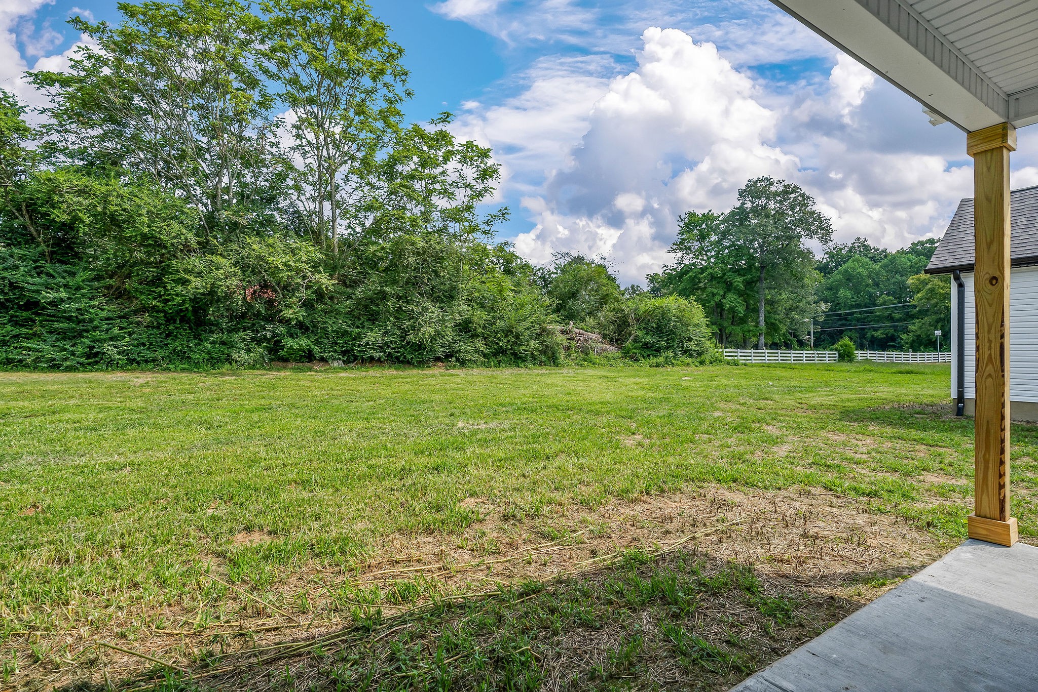 117 Reece Road Baxter, TN 38544 - Photo 27 of 31 a view of a field with an trees in the background