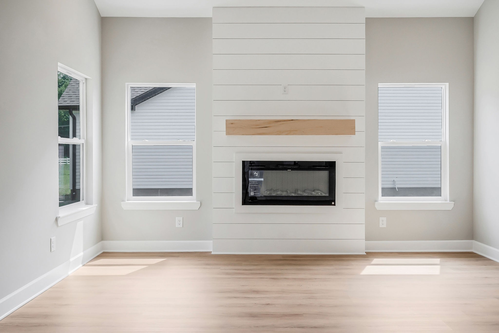 117 Reece Road Baxter, TN 38544 - Photo 5 of 31 a view of an empty room with a window and fireplace
