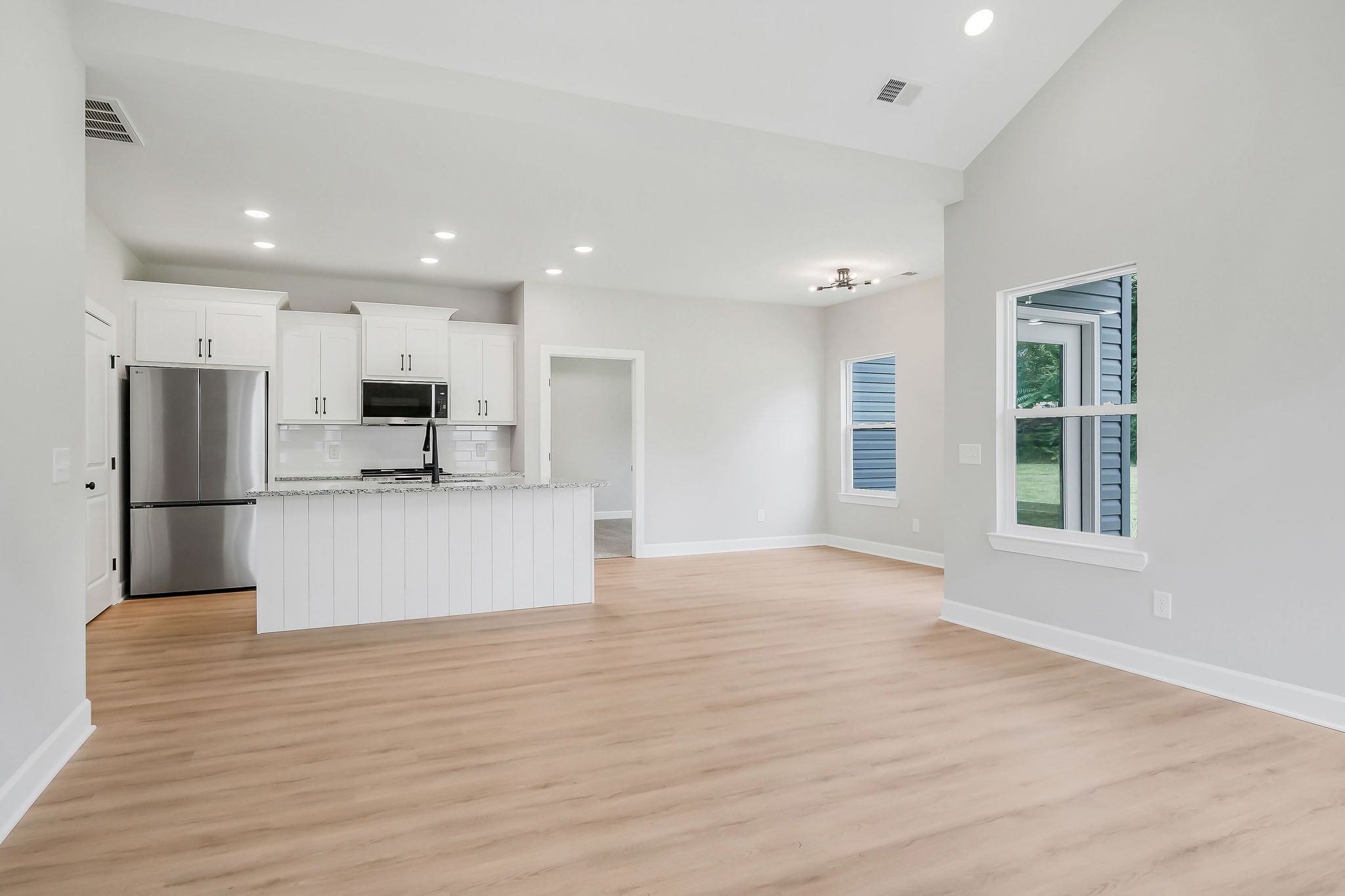 117 Reece Road Baxter, TN 38544 - Photo 6 of 31 a view of kitchen with kitchen island a sink wooden floor and stainless steel appliances