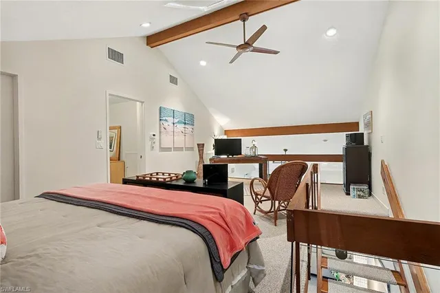 a bedroom with a bed a desk and chair