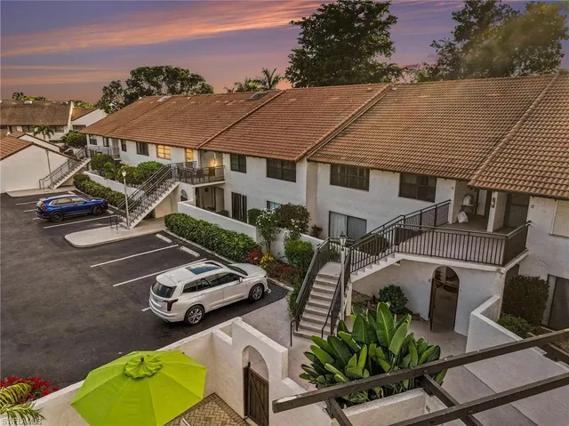 an aerial view of a house with garden space and street view