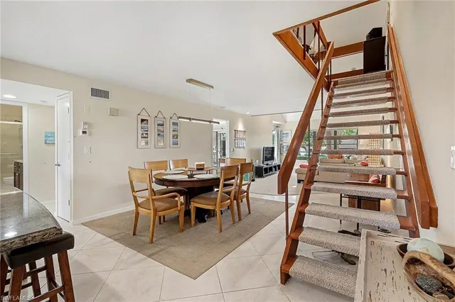 a view of a livingroom with furniture and entryway