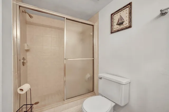 a sign that is sitting in front of flowers