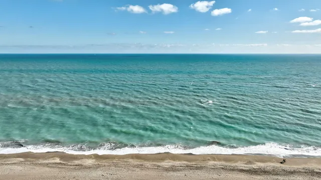a view of a balcony with chairs