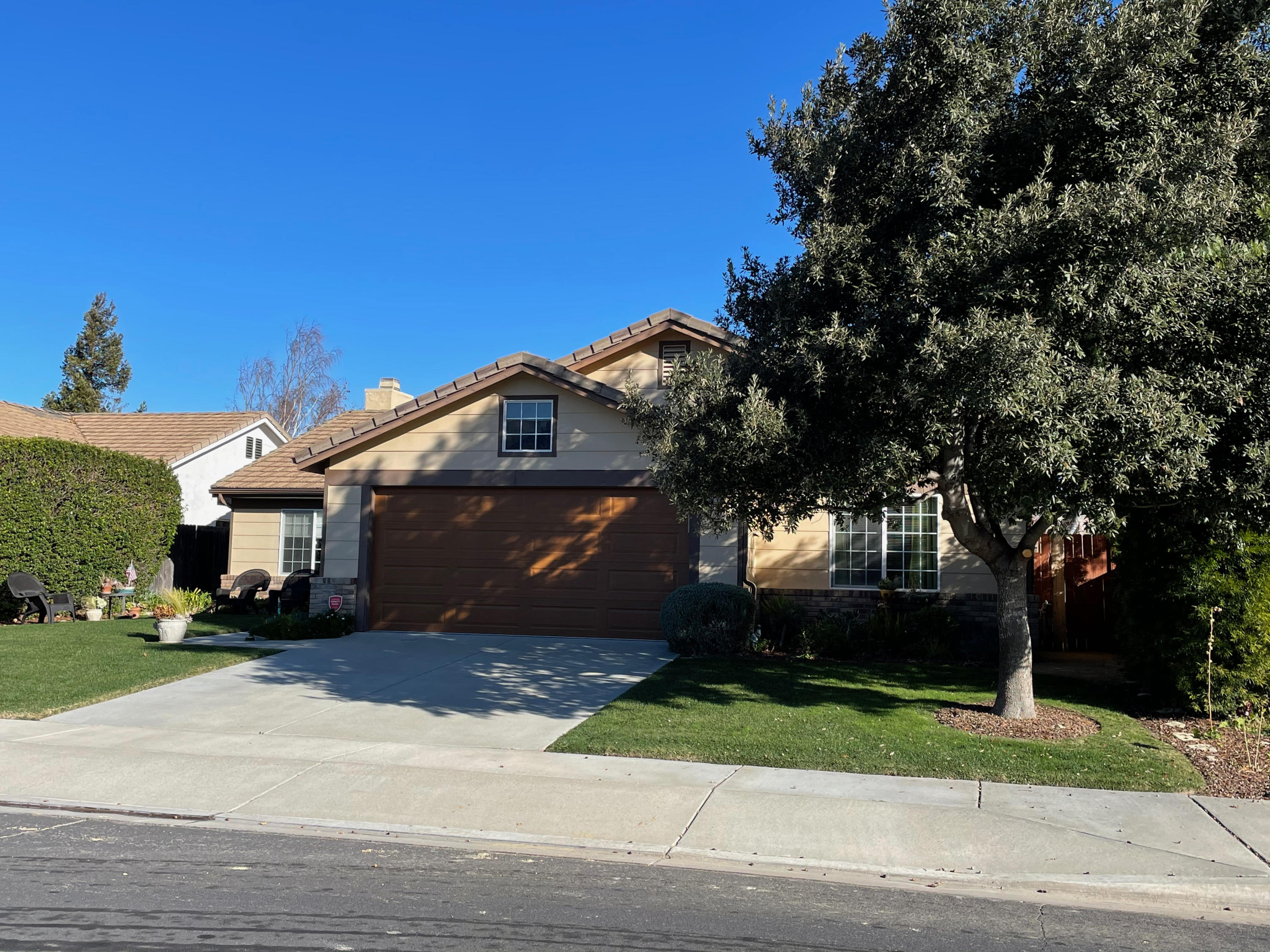 561 Meadow View Drive Buellton, CA 93427 - Photo 1 of 1 a front view of a house with a yard and a garage