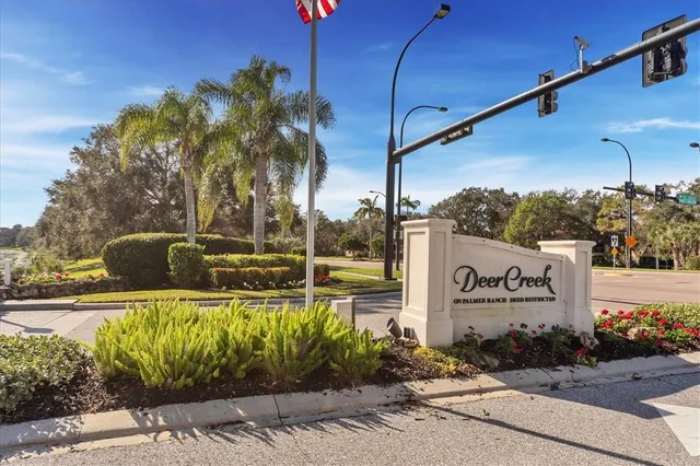 a view of a sign board with a yard