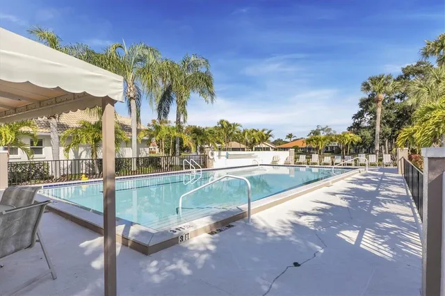 a view of swimming pool with a lounge chair
