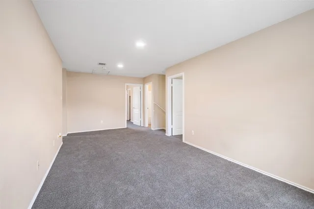 a view of an empty room and window