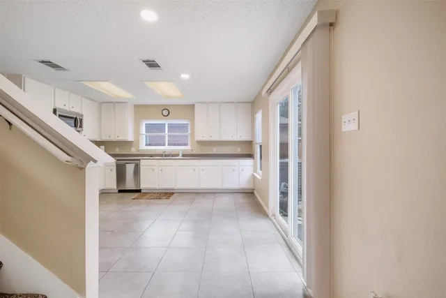 a view of a kitchen with a sink