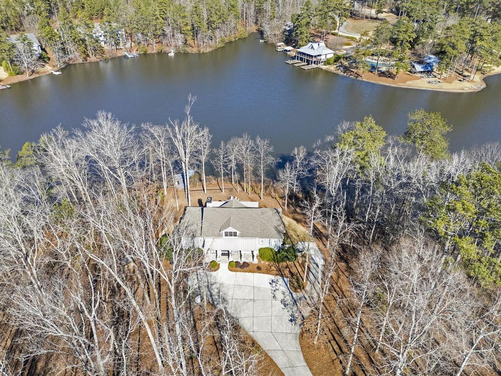 an aerial view of a house with a lake view