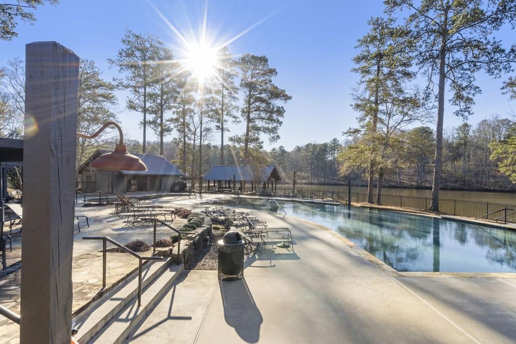 72 Buckeye Ridge Newnan, GA 30263 - Photo 70 of 79 a view of a swimming pool with a patio