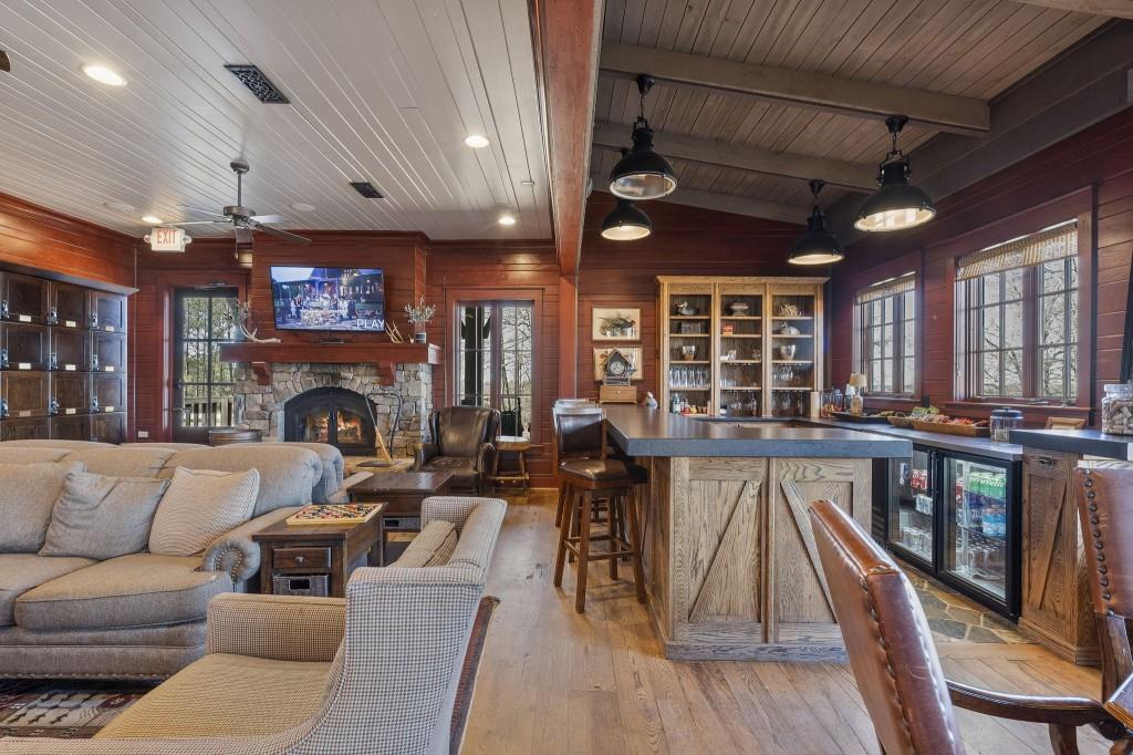 72 Buckeye Ridge Newnan, GA 30263 - Photo 75 of 80 a living room with furniture a fireplace and a flat screen tv