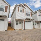 a view of a white building with many windows