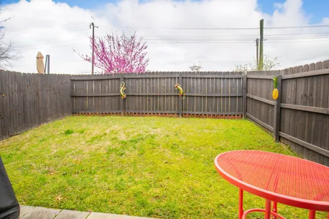 a view of a backyard with a swimming pool