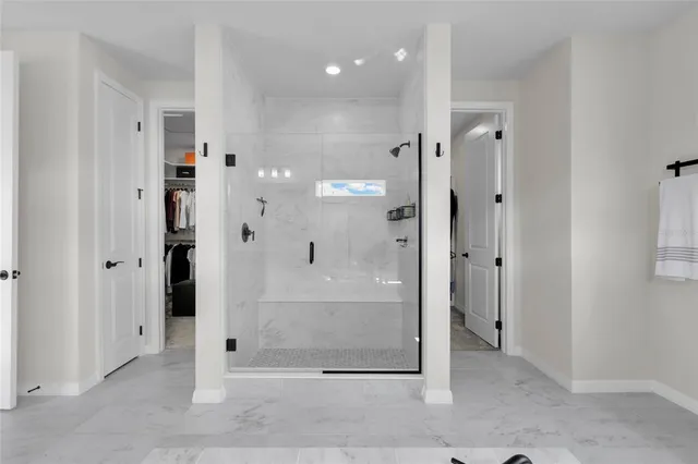 a view of a bathroom with shower