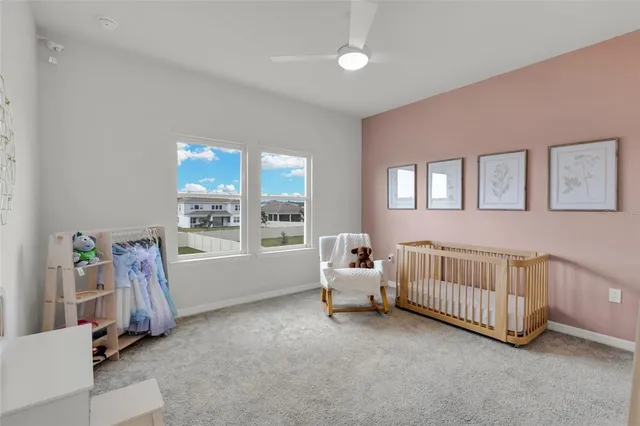 a view of a bedroom with furniture and windows