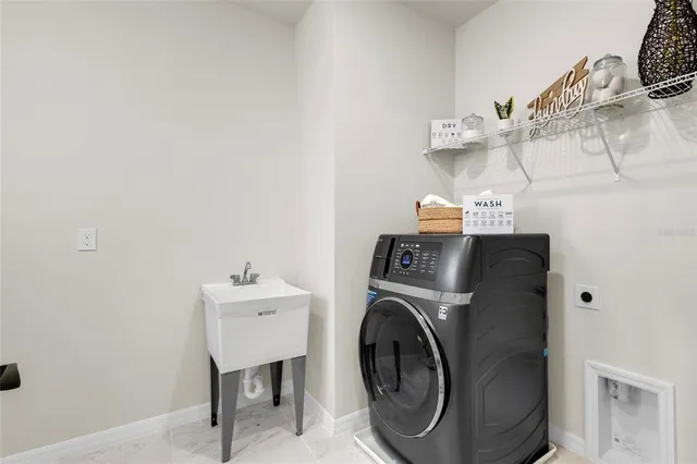 a utility room with dryer and washer