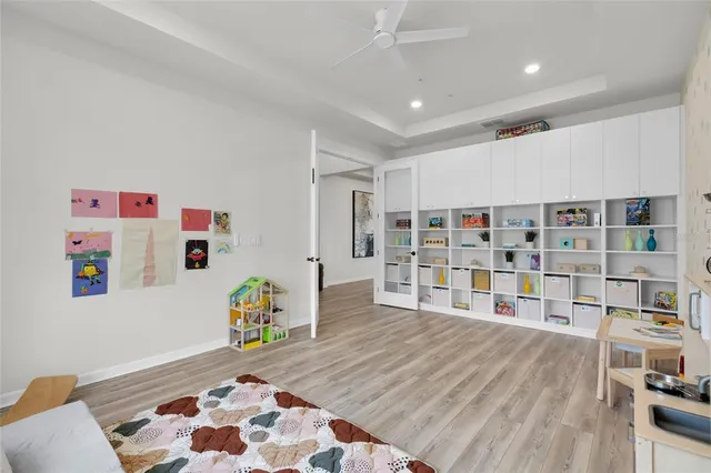 a room with a book shelf and a couch