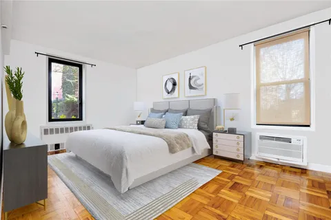 a bedroom with a large bed and a window