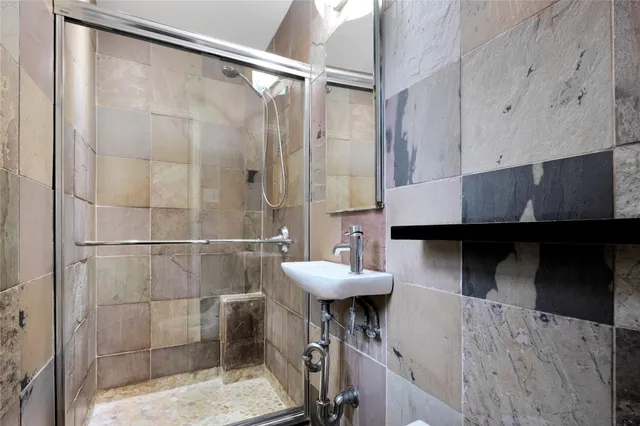 a bathroom with a sink and mirror