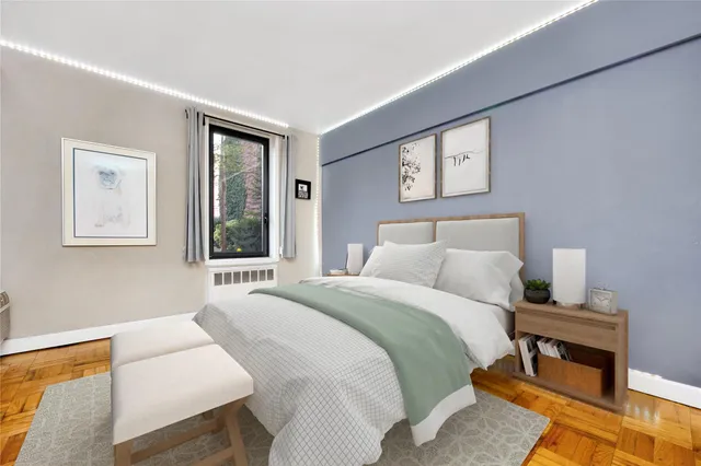 a bedroom with a bed a couch and a window