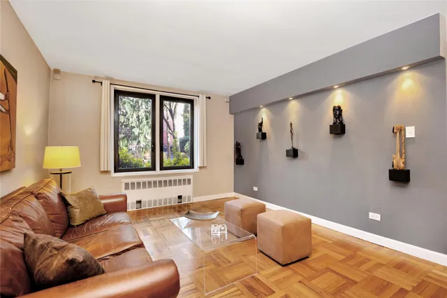 a living room with furniture and a lamp