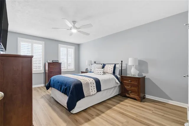 a spacious bedroom with a bed and window