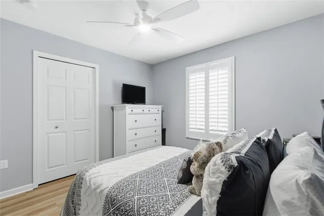 a bedroom with a bed and a tv