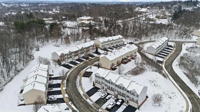 an aerial view of a house with outdoor space