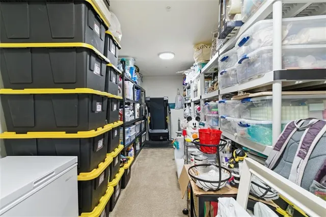 a view of water heater room with lots of stuff