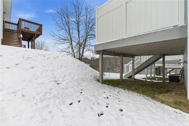 a view of a backyard with wooden fence