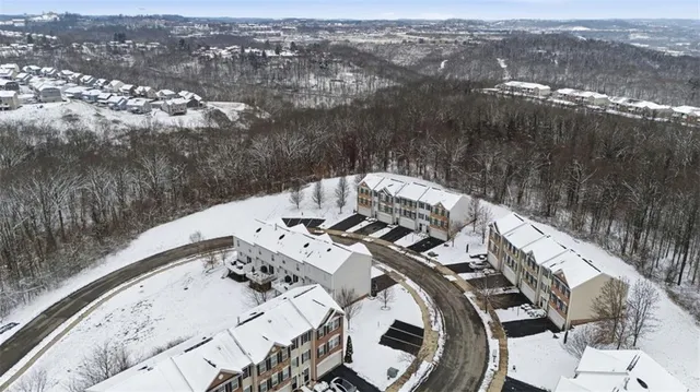 an aerial view of a house with outdoor space
