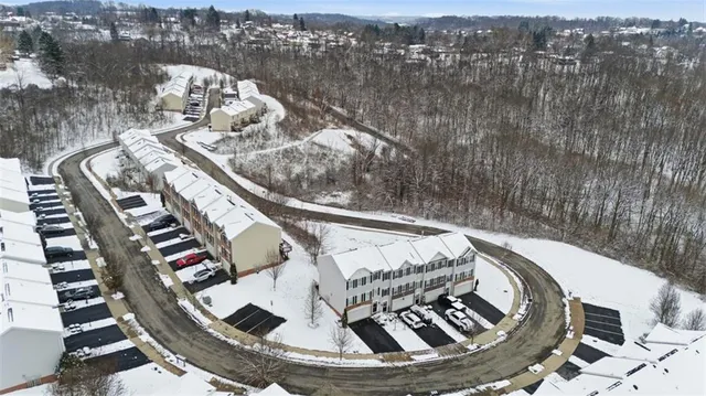 a view of a white apartments with large windows