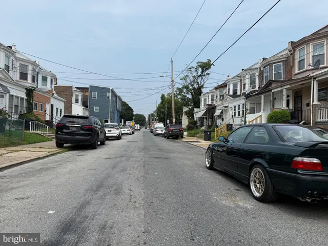 a view of street with parked cars
