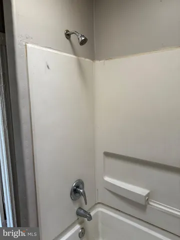 a view of a small space with wooden floor and staircase