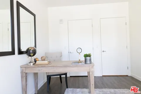 a view of a bathroom with a sink and a mirror