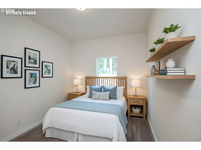 a bedroom with a bed and window