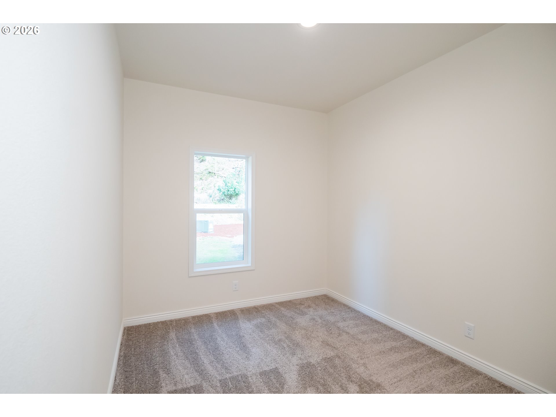 42276 Winberry Creek Road Fall Creek, OR 97438 - Photo 24 of 30 an empty room with wooden floor and window